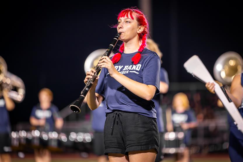 Students perform on football field